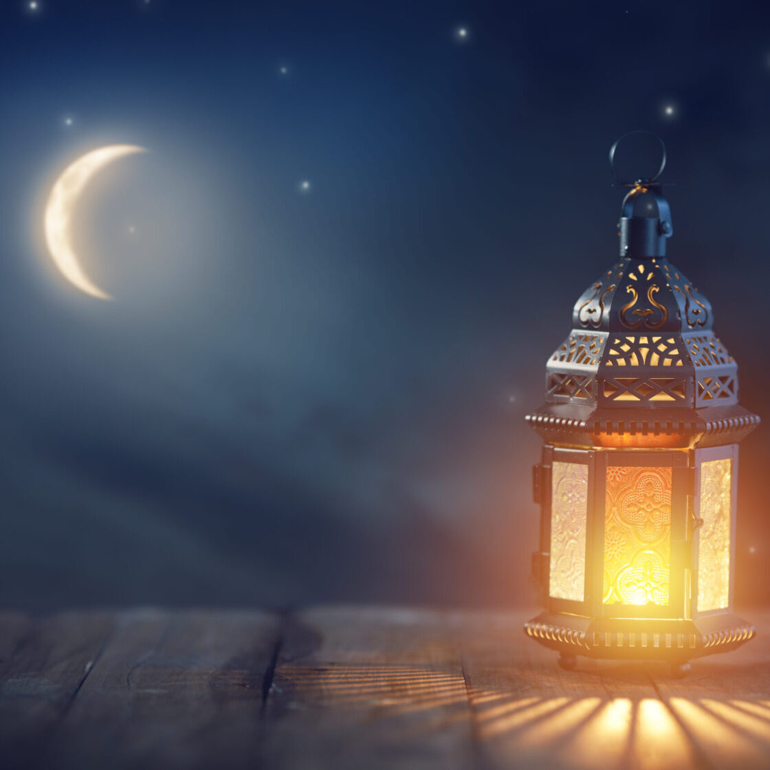 Ornamental Arabic lantern with burning candle glowing at night. Festive greeting card, invitation for Muslim holy month Ramadan Kareem.